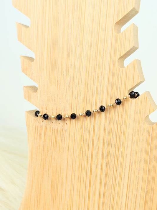 Cavigliera in acciaio con cristalli neri