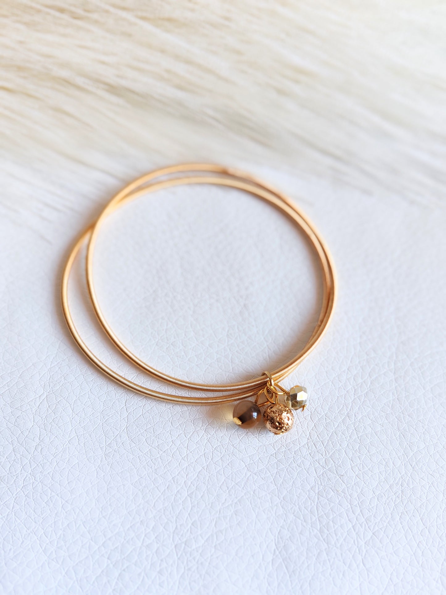 Bracciale elastico in acciaio dorato
