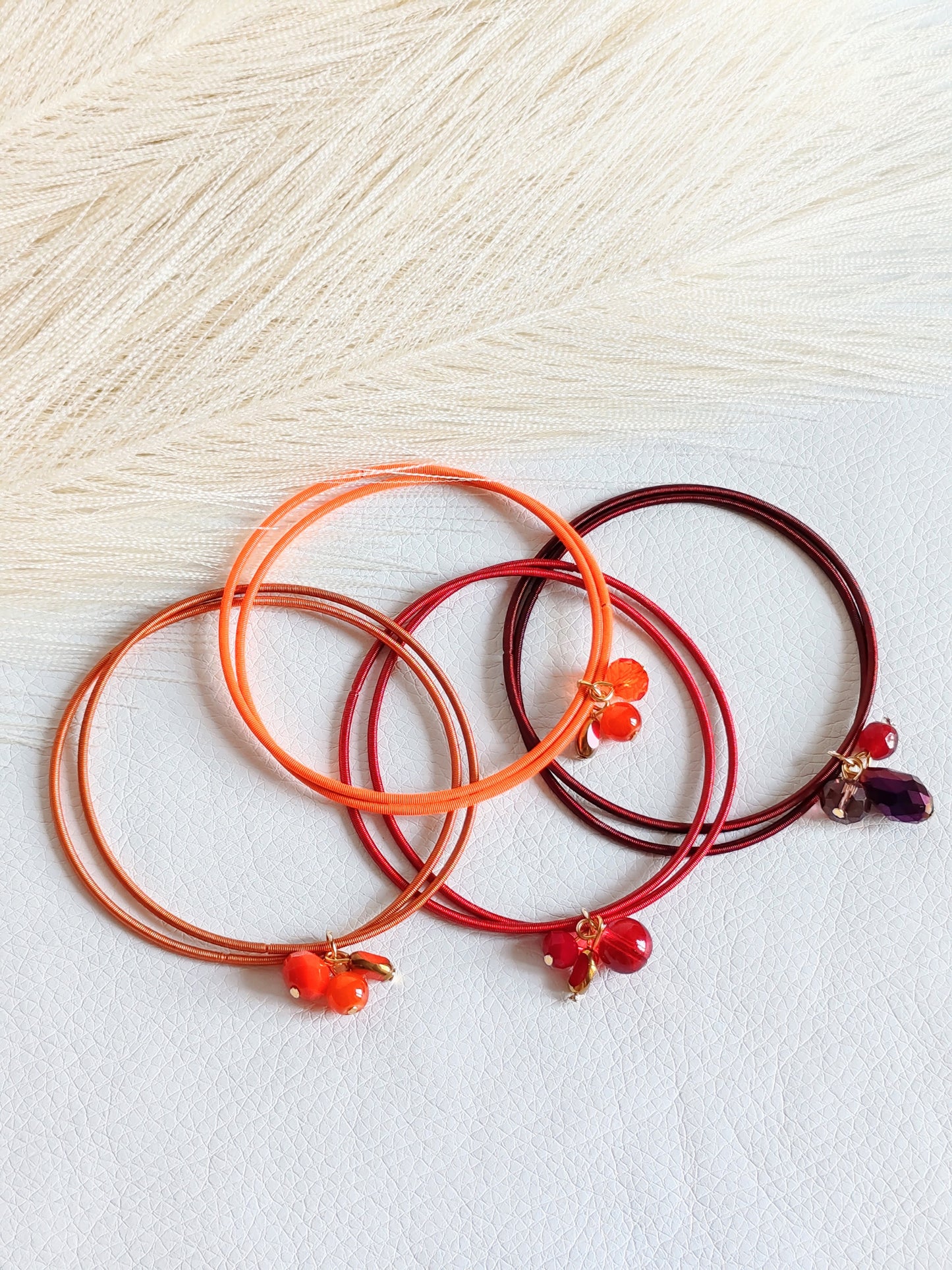 Bracciale elastico in acciaio arancio bruciato