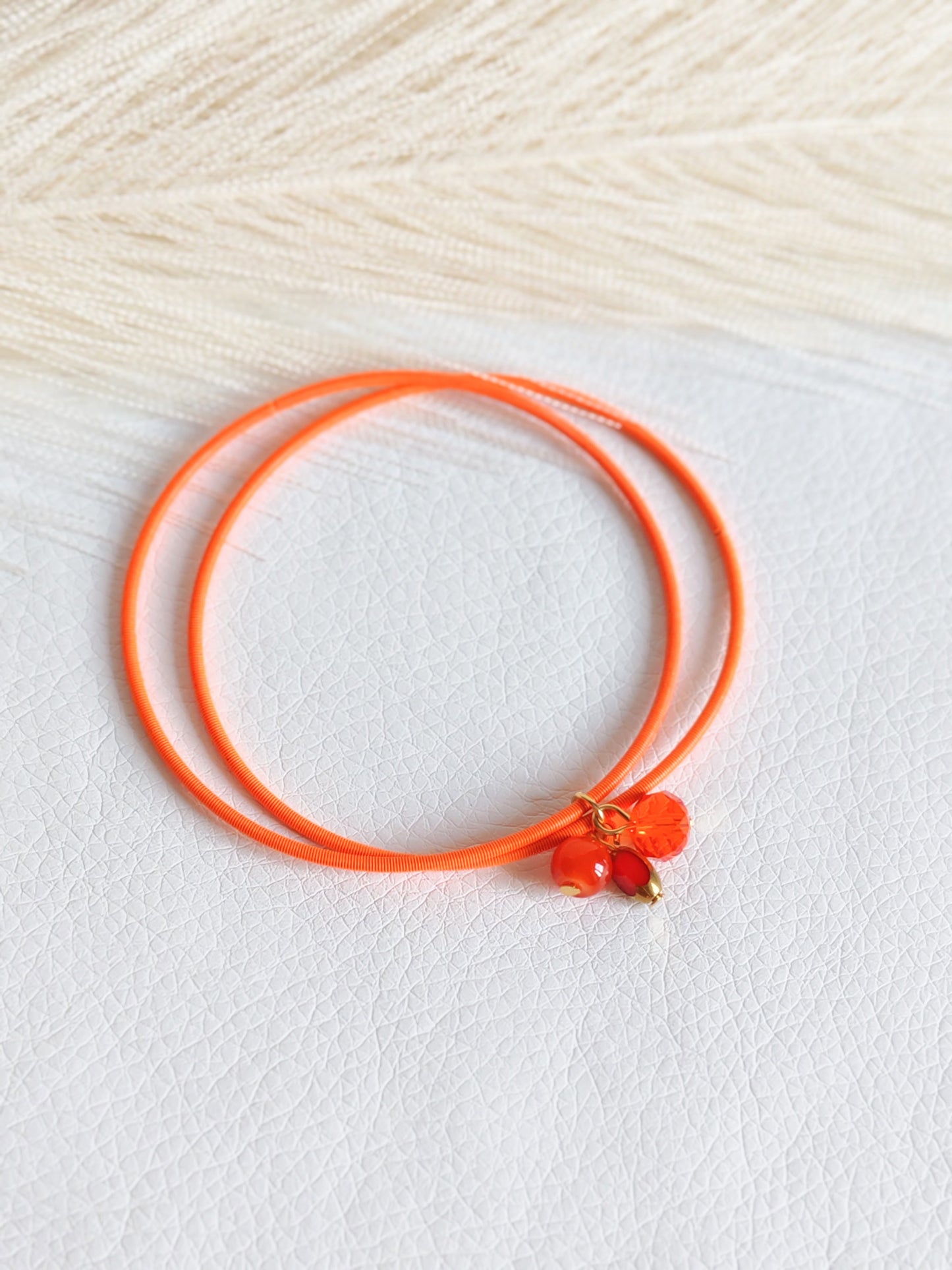 Bracciale elastico in acciaio arancio fluo