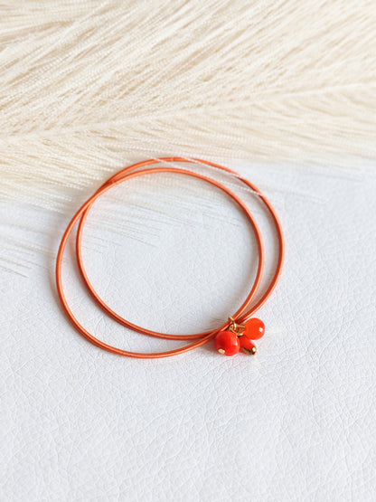 Bracciale elastico in acciaio arancio bruciato