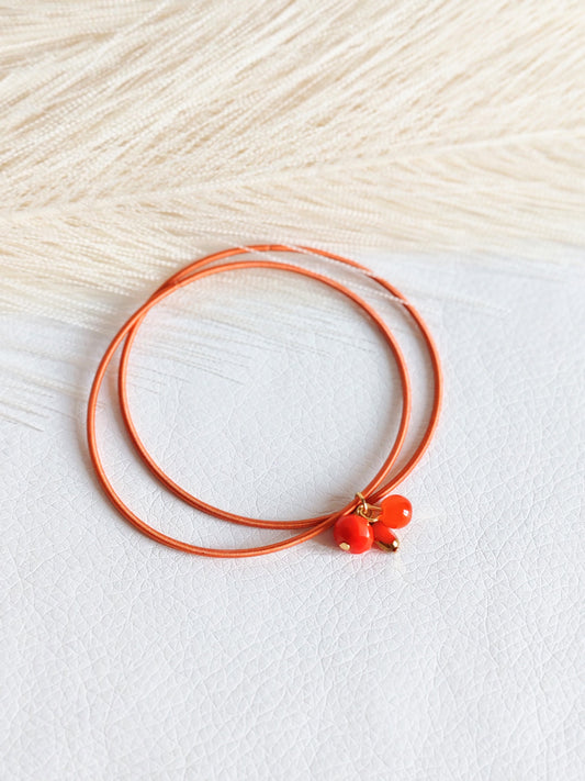 Bracciale elastico in acciaio arancio bruciato