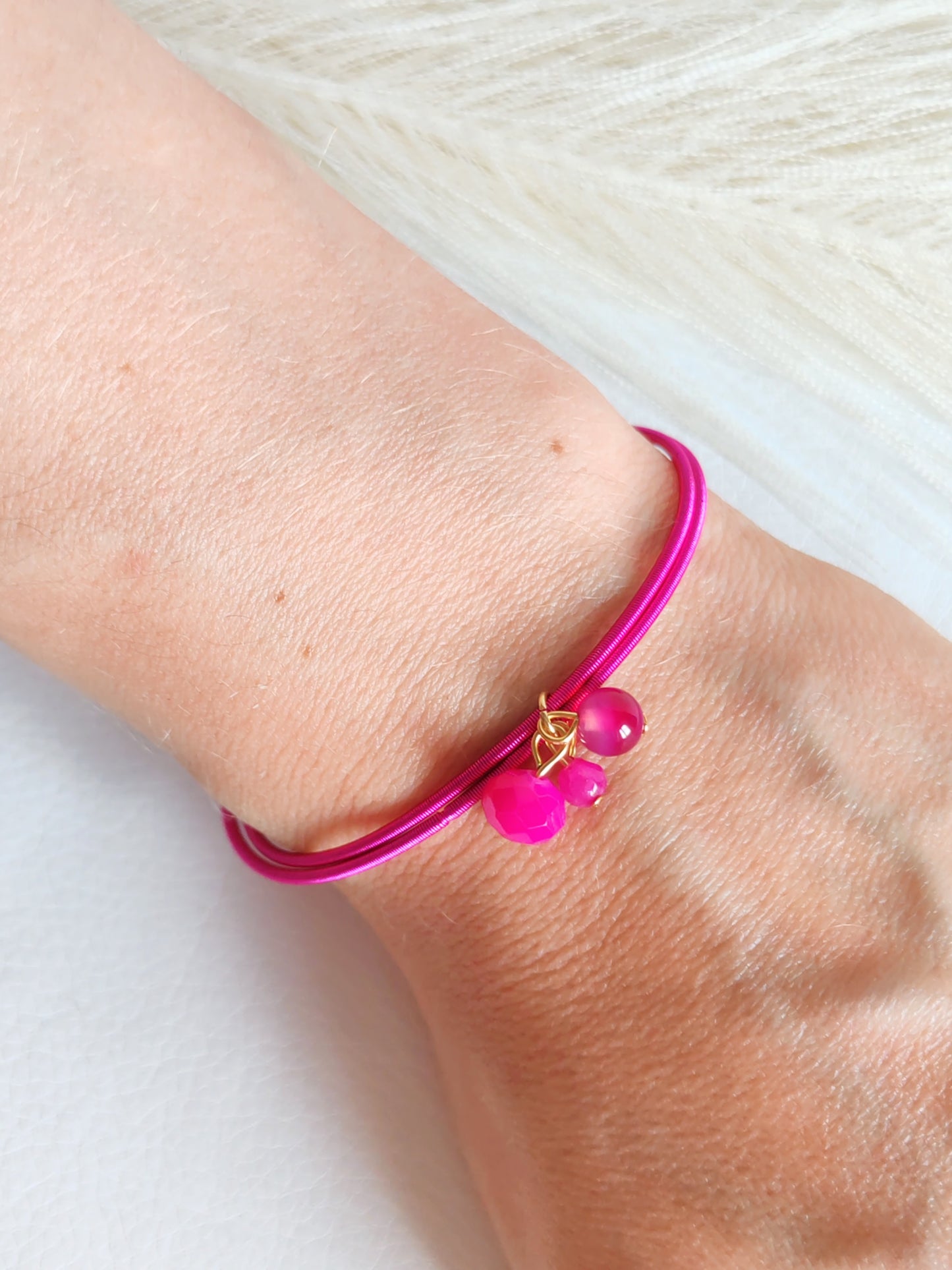 Bracciale elastico in acciaio fucsia